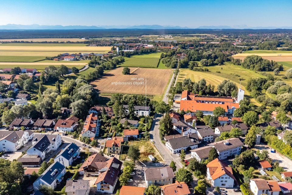 Toplage in der Ortsmitte: Grundstück von 1.181 m² mit genehmigter Bebauung in Taufkirchen