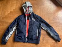 Neuwertige Superdry blaue Jacke Windbreaker Größe XL, 38 ,40,42 Köln - Rath-Heumar Vorschau