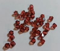 5 Tüten Swarovski ® Kristalle 4mm Doppelkegel rot braun Schimmer Niedersachsen - Bockenem Vorschau