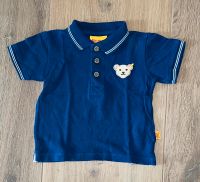 Blaues Steiff Poloshirt kurzarm mit Bärchenlopf Gr. 74 Niedersachsen - Hessisch Oldendorf Vorschau