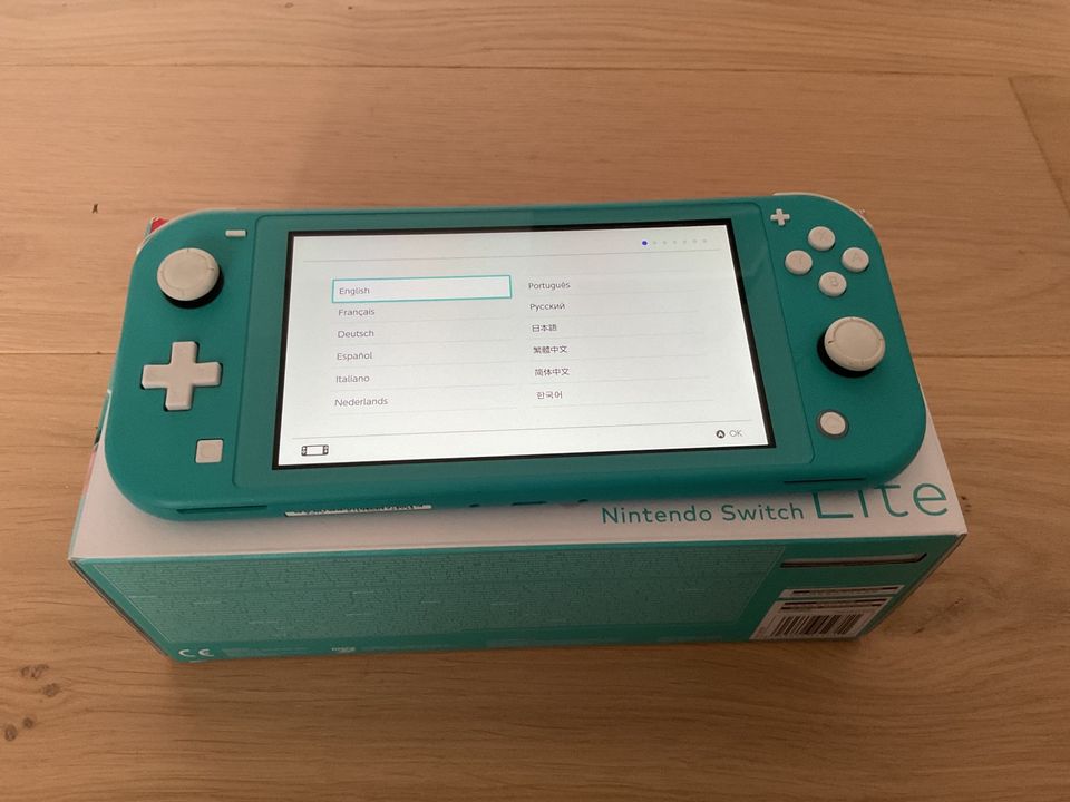 Nintendo Switch Lite mit Spielen Versand inklusive in Zeven