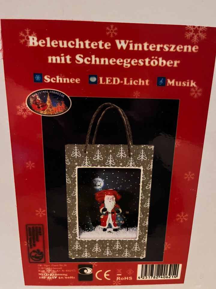 Neu in OVP Schneiende Geschenktüte Deko mit Musik und LED Licht in Aachen