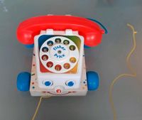 Fisher Price Telefon von 1961 mit Wählscheibe und Rollen Hessen - Groß-Rohrheim Vorschau