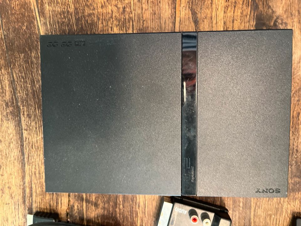 PlayStation 2 Slim schwarz inkl Singstar Microphone und 3 Spielen in Marl