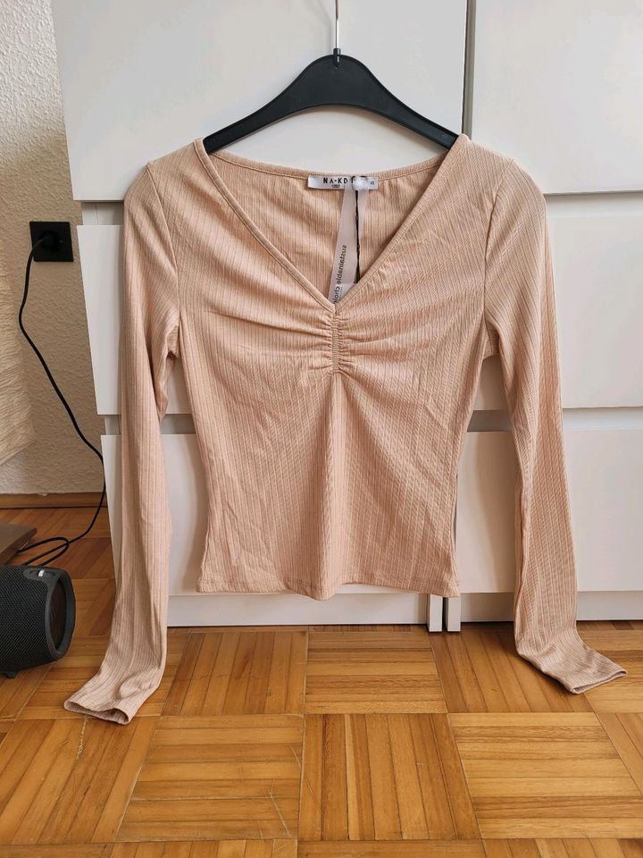 Shirt von NAKD, beige gerippt, Langarm, Raffung, XS in Düsseldorf