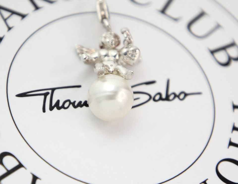 Thomas Sabo Charm "Engel auf weißer Perle, Herz" Anhänger, Silber in Usingen