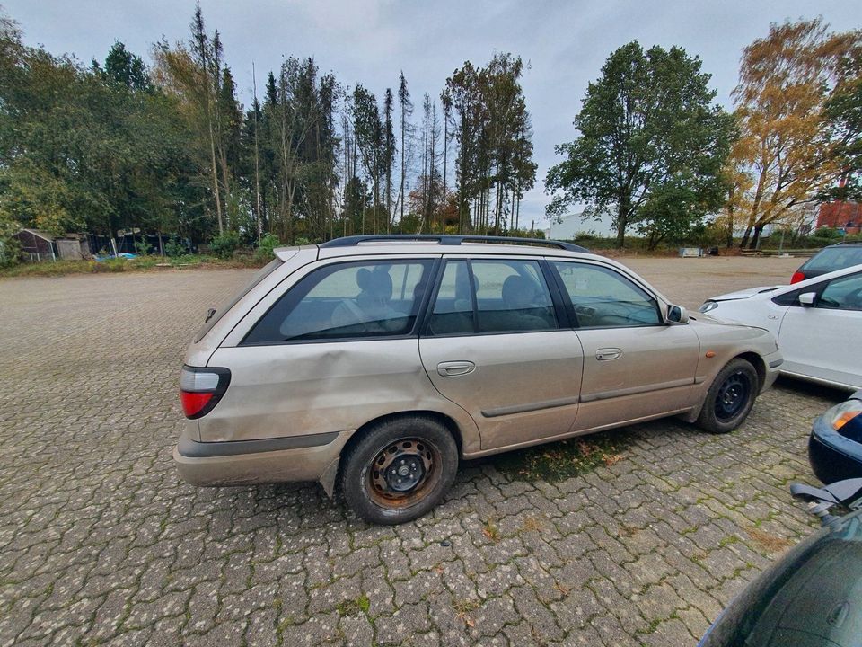 Mazda 626 Schlachtfest Ersatzteile Einzelteile Grau Bj.1998 in Bremervörde