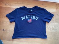H&M Divided T-Shirt Gr. XS blau mit Schriftzug Malibu Nordrhein-Westfalen - Reichshof Vorschau