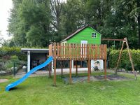 Kinder Spielhaus Stelzenhaus mit Schaukel und Rutsche. Nordrhein-Westfalen - Schloß Holte-Stukenbrock Vorschau