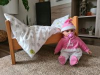 Puppenbett mit Puppe (macht Geräusche) Bett Baby Spielzeug Hessen - Lohfelden Vorschau