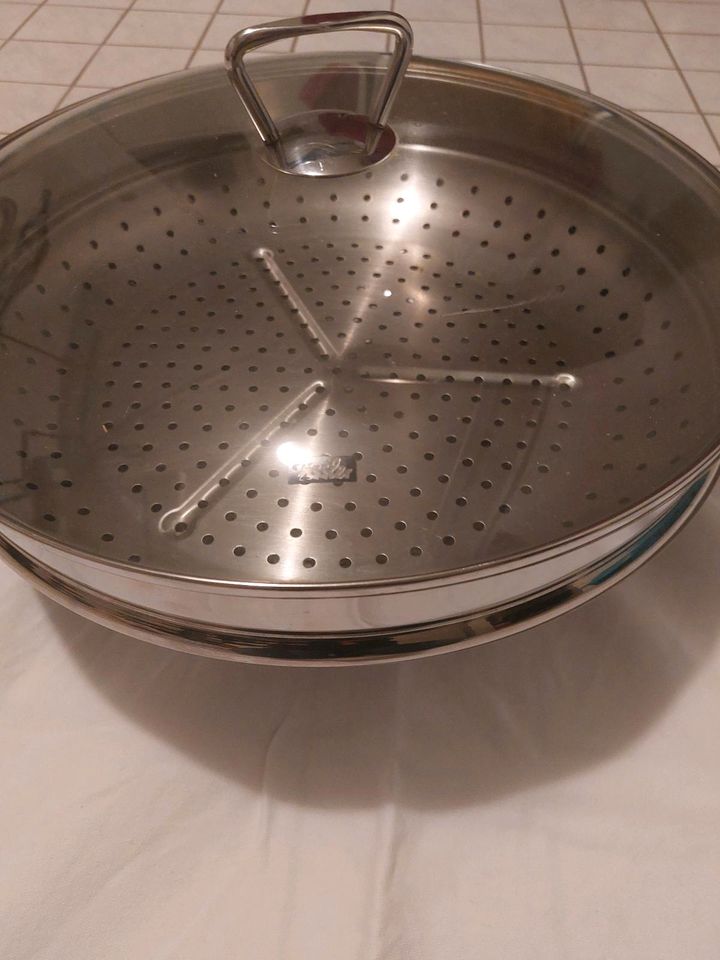 Wok Fissler mit Glasdeckel und Dünsteinsatz in Scheuring