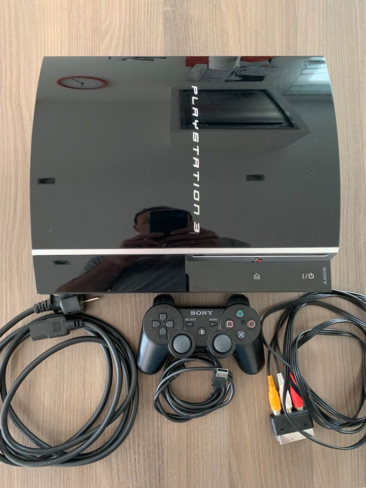 PlayStation 3 mit Zubehör und 8 Spielen in Neudenau 