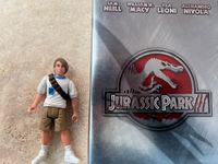 VHS-Kassette Jurassic Park 3+ Action- Figure Tim Murphy 1990 Niedersachsen - Algermissen Vorschau