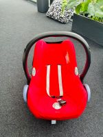 Maxicosi Kinderautositz / Babyschale Rot / Schwarz & Baby Träger Nordrhein-Westfalen - Gescher Vorschau