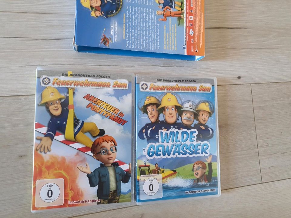 Feuerwehrman Sam Set Uhren Lernbuch Hörspiel DVDs Badehose usw in Möser