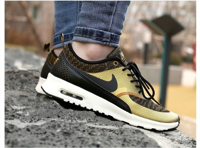 Nike thea black gold hotsell