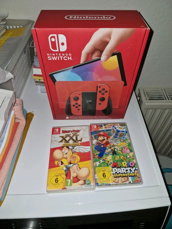 Nintendo Switch Oled + 2 Spiele Kauf 01.03.24 in Weingarten