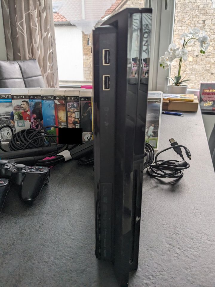 Playstation 3 320 GB + Move + Singstar Mikrofone + Spiele in Ober-Olm