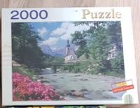 2000 Teile Landschaft Puzzle: Kirche am Fluss, Brücke, Blumen Hessen - Offenbach Vorschau