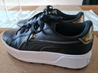 Puma Schuhe Gr.42 Schwarz Weiß Gold Nordrhein-Westfalen - Euskirchen Vorschau