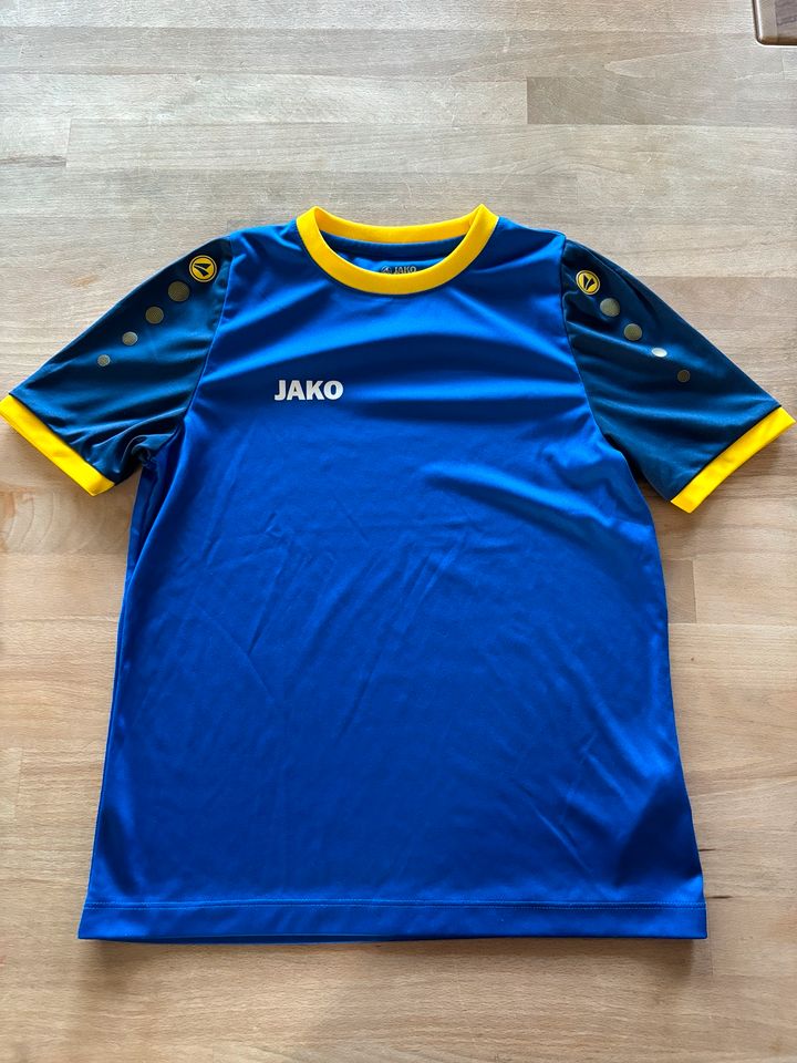JAKO Sportshirt Gr. 128, blau-gelb in Happurg