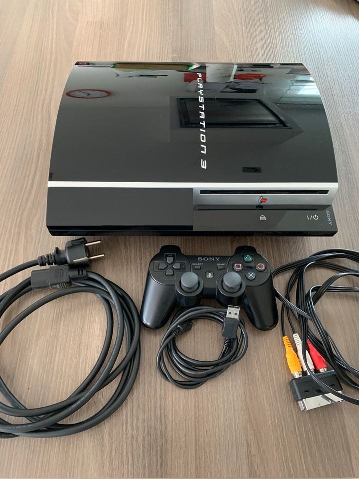 PlayStation 3 mit Zubehör und 8 Spielen in Neudenau 