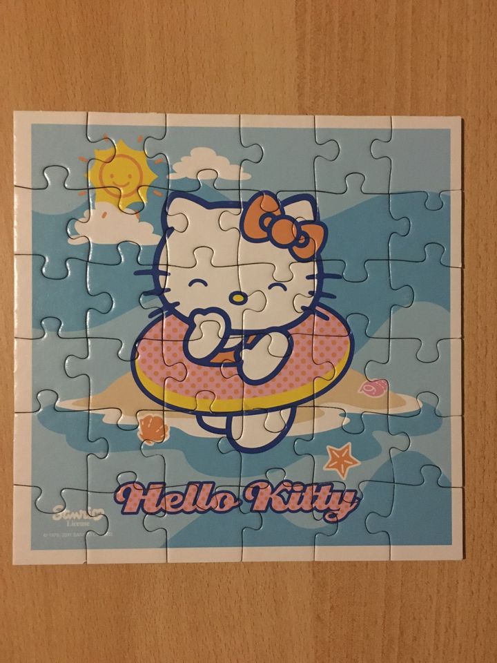 Vier Puzzles von Hello Kitty im Koffer in Osnabrück