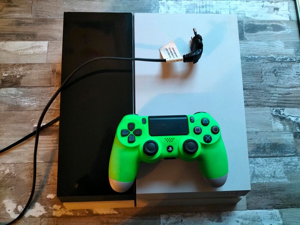 Playstation 4 mit 1 Controller und 11 Spiele in Jüchen