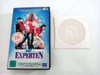 VHS & DVD+R: Die Experten (1989) / The Experts / John Travolta Hannover - Mitte Vorschau