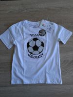 T-Shirt Wendepailetten Fussball Germany weiß Topolino Gr. 104 NEU Brandenburg - Paulinenaue Vorschau
