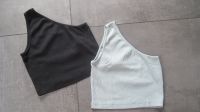 Crop Top 2x one shoulder even & odd schwarz u. oliv grün S Tops Nordrhein-Westfalen - Inden Vorschau