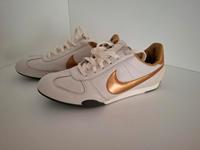 Nike Sneaker 41 weiß gold Leder Berlin - Wilmersdorf Vorschau