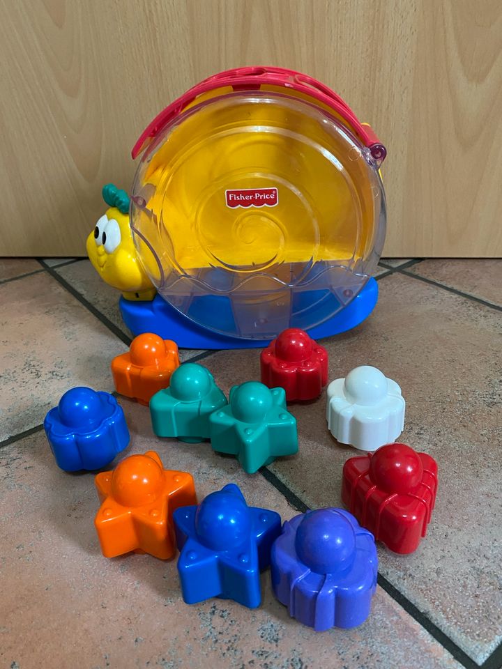 Fisher Price Musikschnecke inkl. Stapelsteinen in Niddatal