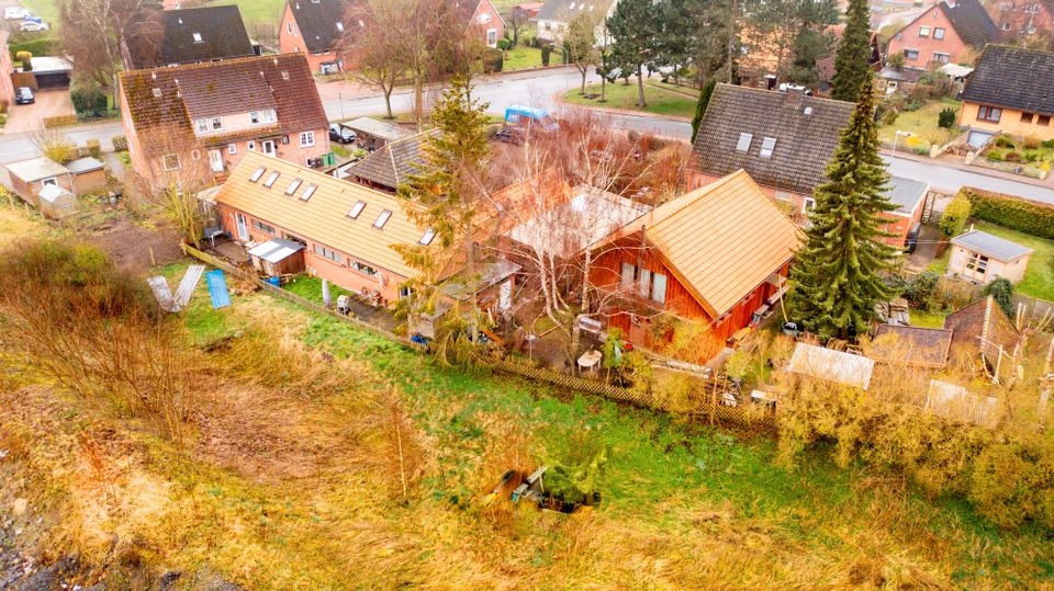 Wohnanlage mit 4 Einheiten - drei vermietete Reihenhäuser und ein freistehendes Holzhaus in Lensahn in Lensahn