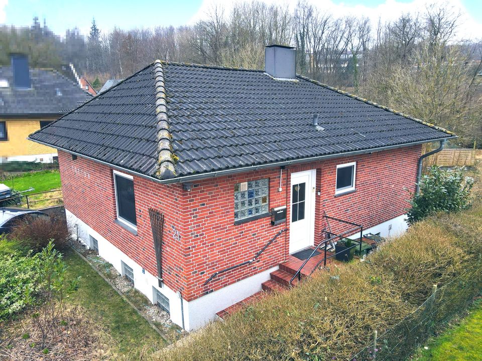 Kupfermühle: Hyggeliger Bungalow am Ende einer Privatstraße zu verkaufen in Harrislee