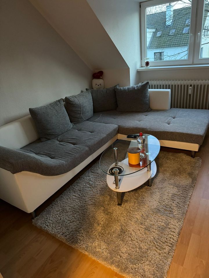 Neuwertiges Ecksofa Sofa Couch grau weiß Kunstleder in Bad Schwartau