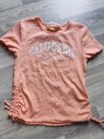 Gr. 134 140 T-Shirt H&M neuwertig lachs/apricot gerafft Niedersachsen - Peine Vorschau