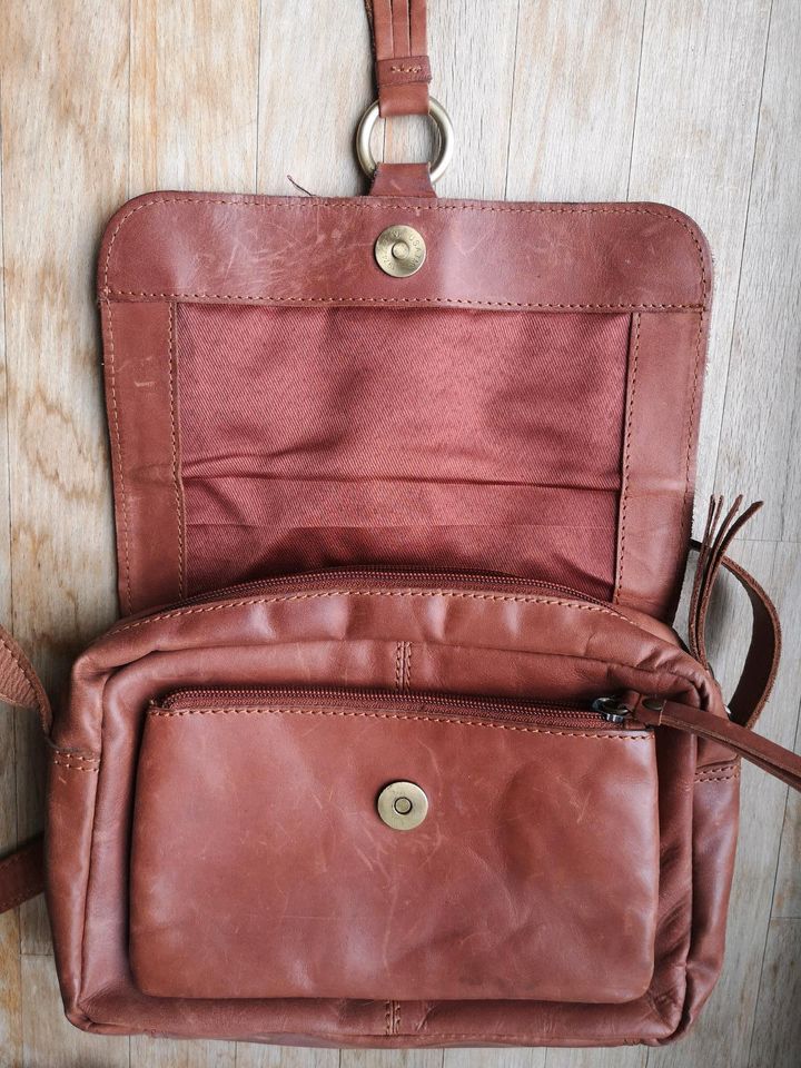 Leder-Handtasche, Saddle Bag, Quaste, cognac-braun in Köln