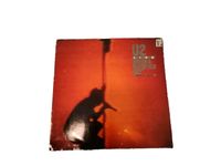 U2s "Under A Blood Red Sky" ist ein Live-Album, das 1983 von Isla Berlin - Tempelhof Vorschau
