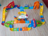 VTech Baby Flitzer Bahnhof,  Rennbahn, Parkgarage, 9 Autos, etc Niedersachsen - Dinklage Vorschau