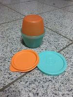 Tupperware Schüttelbecher orange und grün Schleswig-Holstein - Altenholz Vorschau