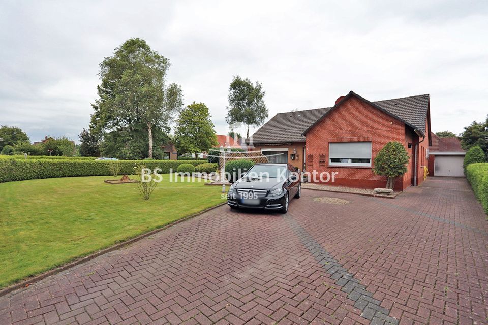 Großes Zweifamilienhaus mit Wintergarten, Gartenanlage, Garage und in ruhiger, zentraler Wohnlage! in Moormerland