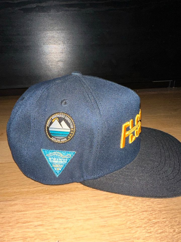 Flgntlt Wörthersee Cap / Community Shirt 70/100 in Mönchengladbach