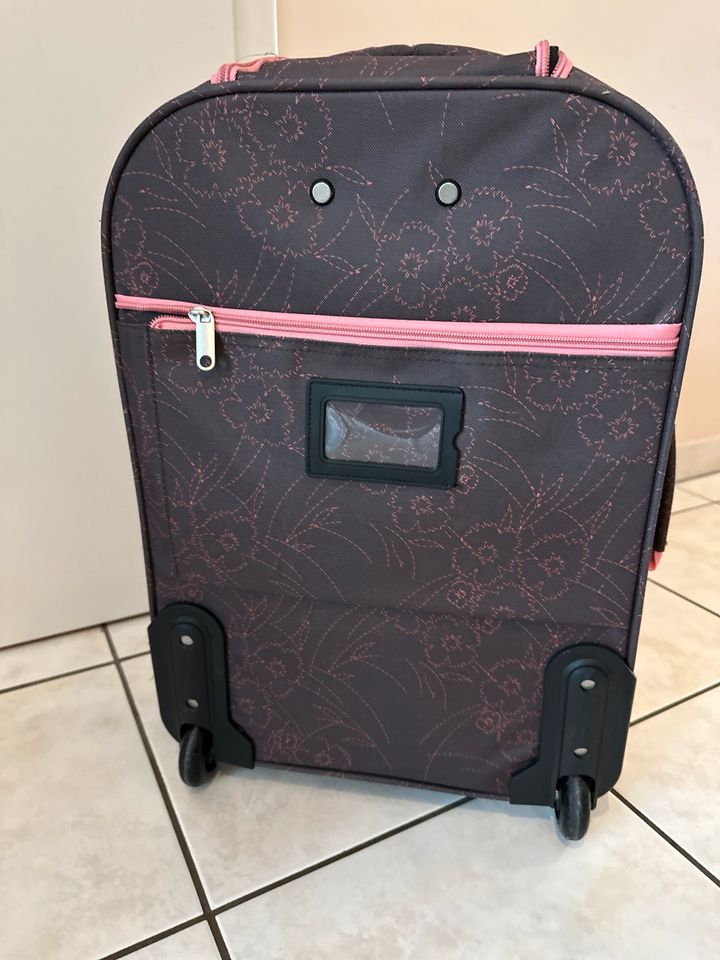 Reisekoffer mit rosa Blütenmuster in Niederkassel
