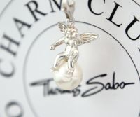 Thomas Sabo Charm "Engel auf weißer Perle, Herz" Anhänger, Silber Hessen - Usingen Vorschau