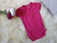 Kurzarmbody Rüsche pink beere uni Gr. 56 Name It *NEU* Brandenburg - Cottbus Vorschau