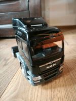 herpa - MAN TGX GX Zugmaschine, schwarz Bayern - Großkarolinenfeld Vorschau