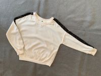 Benetton Langarmshirt cremeweiß mit schwarzen Pailletten Gr. 120 Niedersachsen - Harsum Vorschau