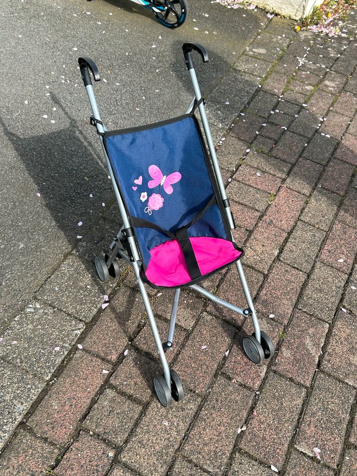 Puppenbuggy dunkelblau pink in Lüdenscheid