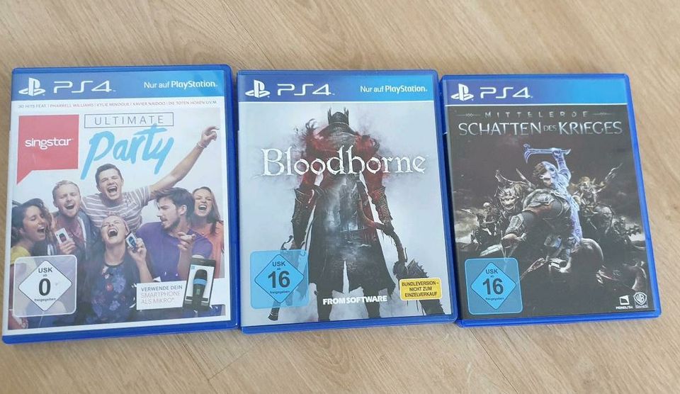 Playstation 4, mit 2 Controllern und allen Kabeln und 3 Spielen in Gelting Angeln